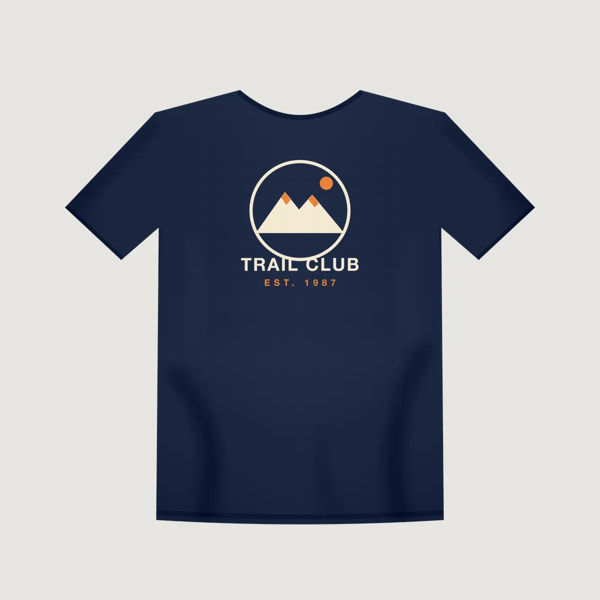 Flat mockup of a navy t-shirt with the "Trail Club 1987" print